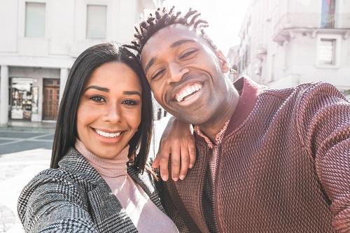 young couple smiling l cosmetic dentist new orleans