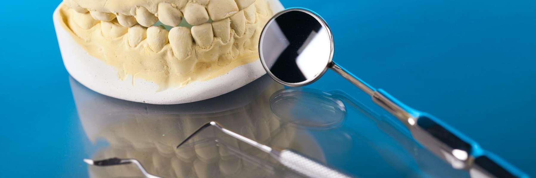 dental model with a mirror and tools in New Orleans