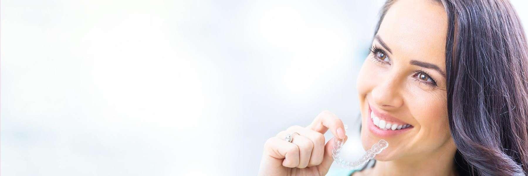 woman smiling with invisalign | new orleans