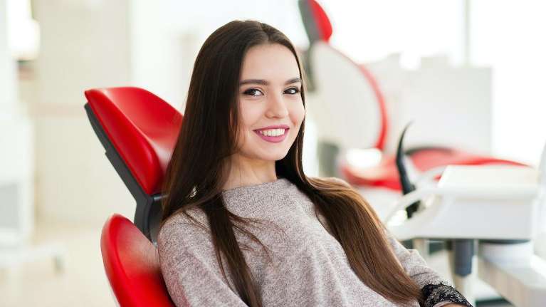 Lady patient in New Orleans receiving dental crown